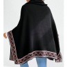 Black turtleneck poncho with ethnic pattern